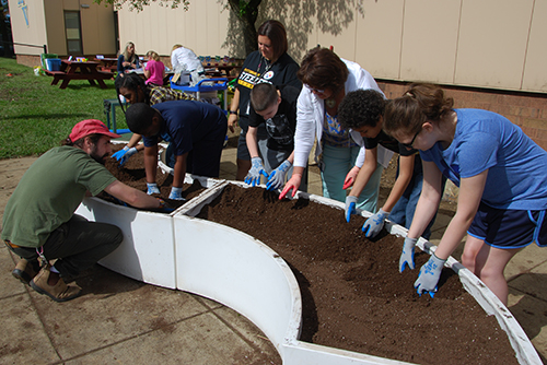 Photo of students planting