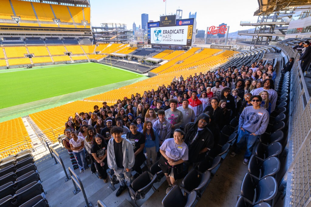 A group photo of students in football stadium stands