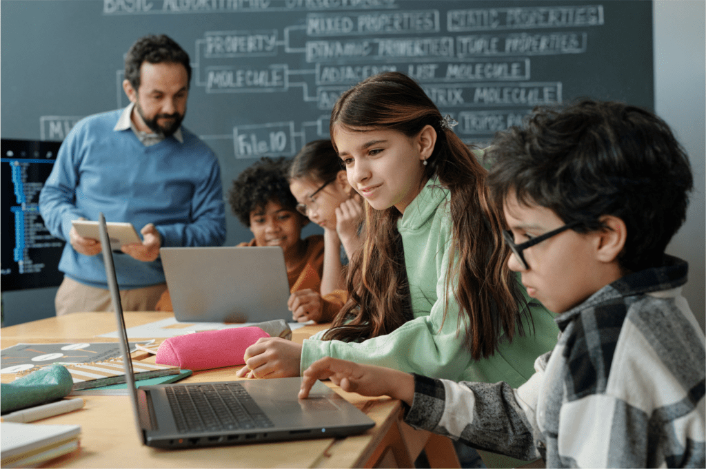 students using computers in classroom