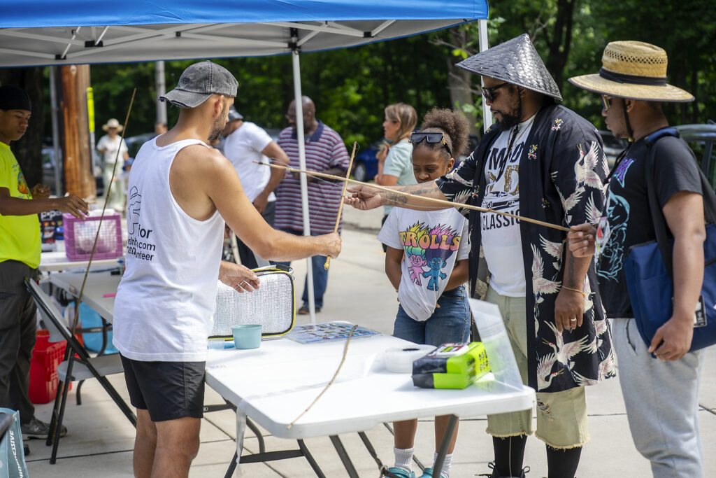 Fishburgh staff getting families equipped with fishing gear